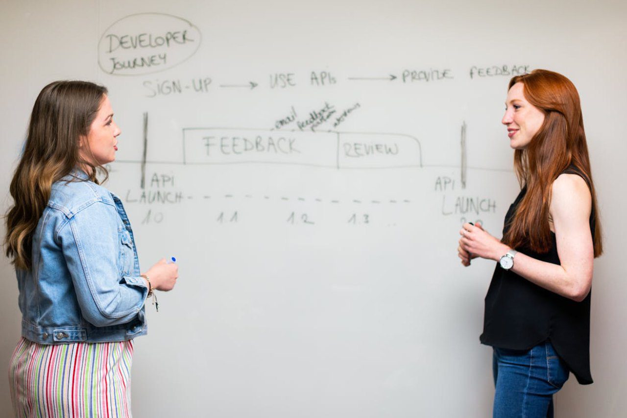 Two business people discussing